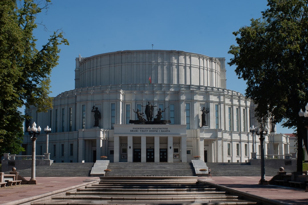 A large building with a fountain in front of it